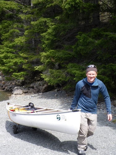 Ian portaging the canoe
