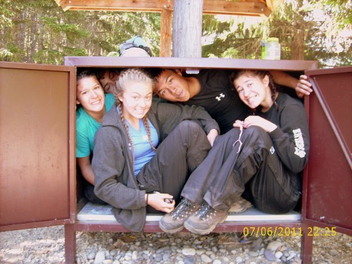 students in bear box