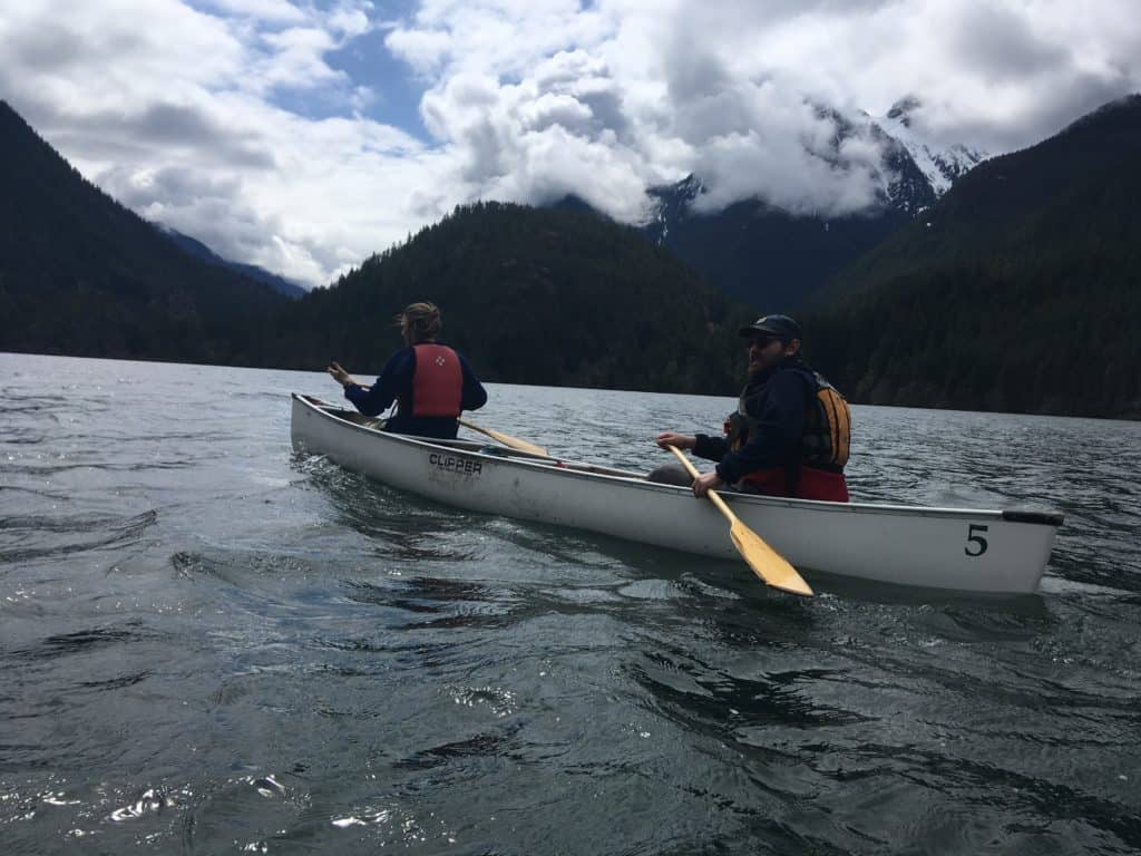 Nate Trachte and Tanner Johnson canoe on Diablo Lake in North Cascades National Park