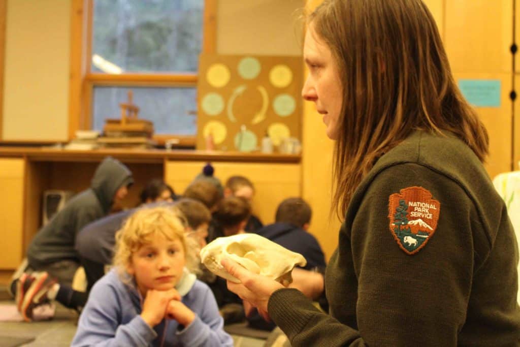 Park Ranger teaches 5th grade students about skulls during mountain school